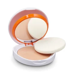 Compact solaire Heliocare ouvert avec miroir et éponge.