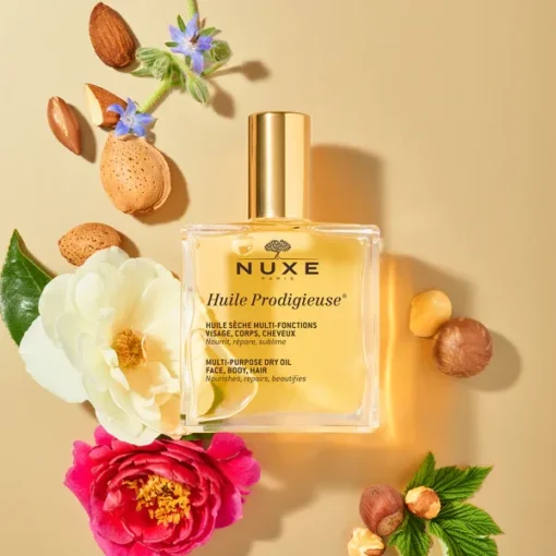 Huile Prodigieuse de Nuxe avec fleurs et noix, soin multi-usages pour visage, corps, cheveux.